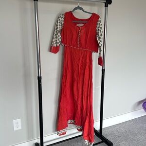 Orange Kurta with cutout design on both side hips..